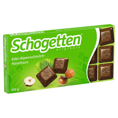 Schogetten Premium Alpine mælkechokolade med hasselnødder, 100 g chokoladebar, individuelt portioneret. En fryd. Stykke for stykke.