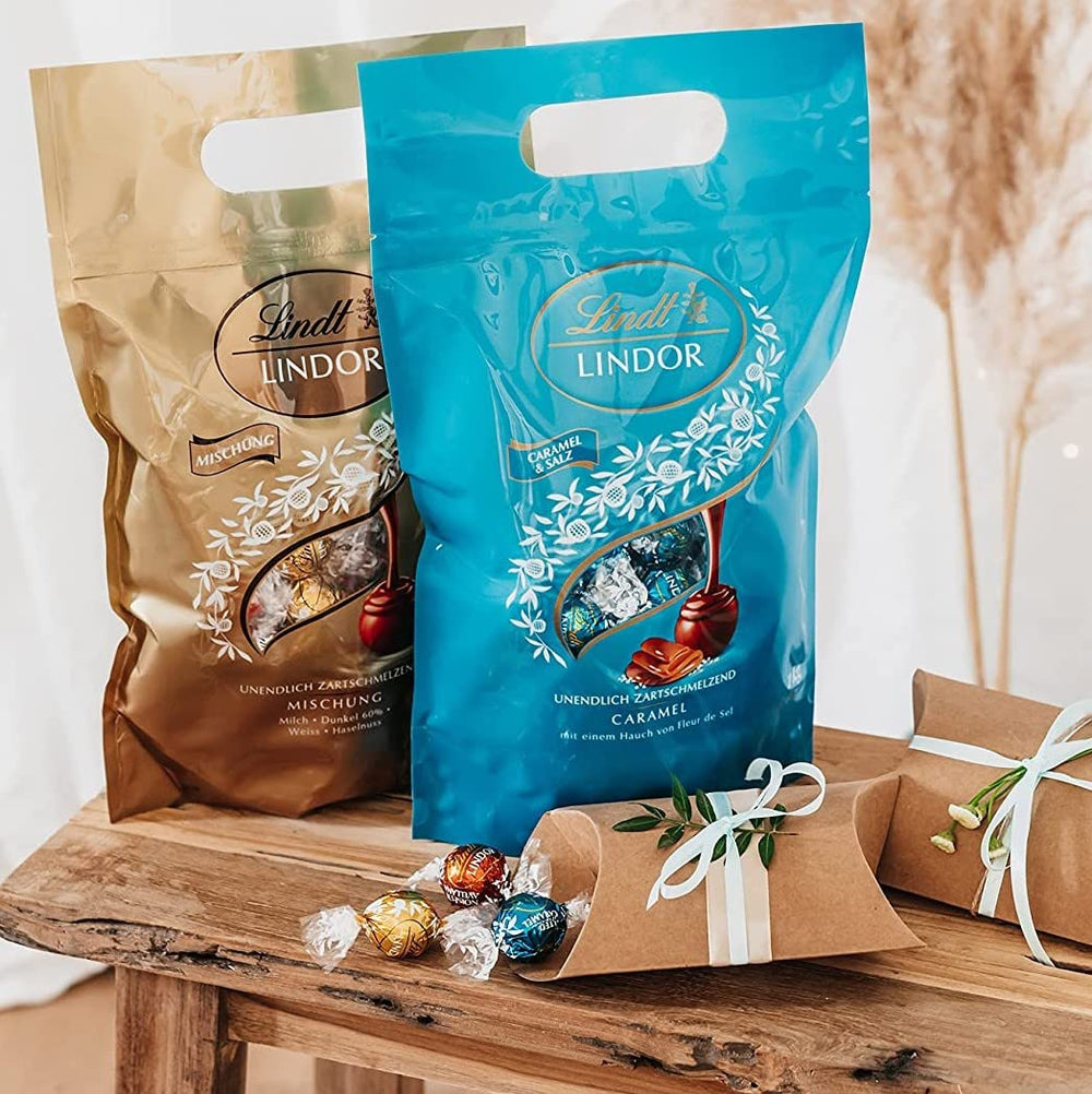 LINDOR chokoladekugler med saltet karamel | ca. 80 mælkechokoladekugler med saltet karamelfyld | Bulk Pack & Marc de Champagne Chokoladekugler | 700 g