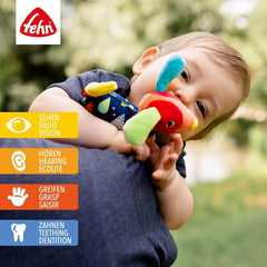 Fehn 055283 Jucărie de prindere câine cu teether COLOR Friends - Jucărie pentru copii cu clopoțel, squeaker și teether moale pentru bebeluși și copii mici de la 0+ luni - Dimensiune: 16 cm Jucarii Bebe Naty Shop